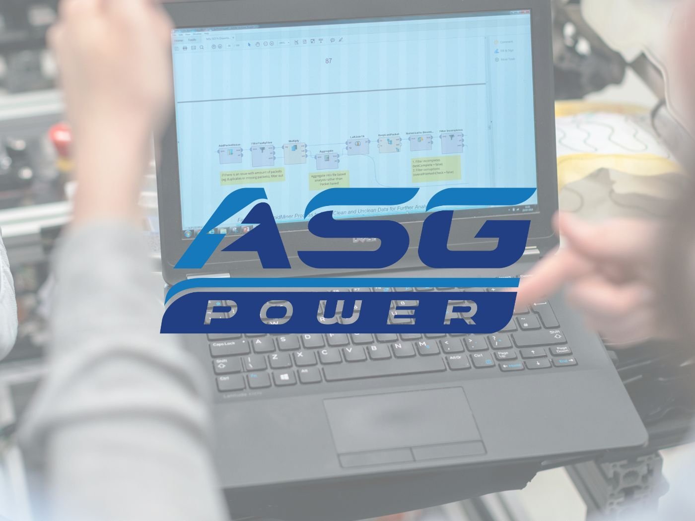 An ASG Power logo superimposed over an image of a laptop